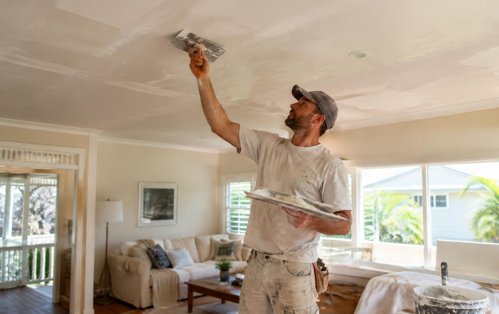 Plasterer repairing a ceiling in a North Brisbane home